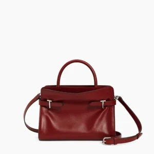 Medium structured burgundy leather handbag featuring both smooth leather and nubuck, black top handles, silver hardware, and a detachable crossbody strap.