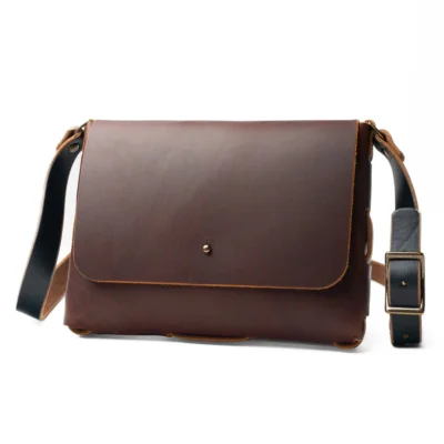 Everyday Leather Satchel in dark brown full-grain leather with a front flap and adjustable shoulder strap.