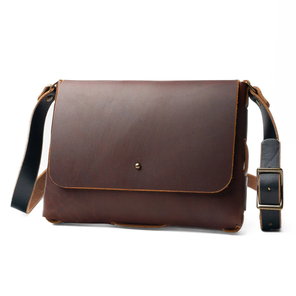 Everyday Leather Satchel in dark brown full-grain leather with a front flap and adjustable shoulder strap.