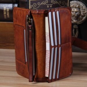 Vintage brown leather wallet with zipper pocket and multiple card slots